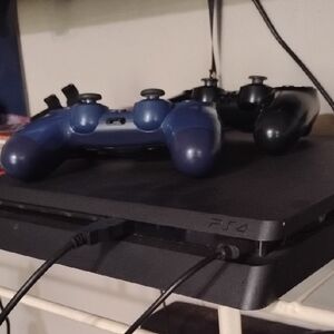 Sony PS4 Console with Black and Blue Controllers